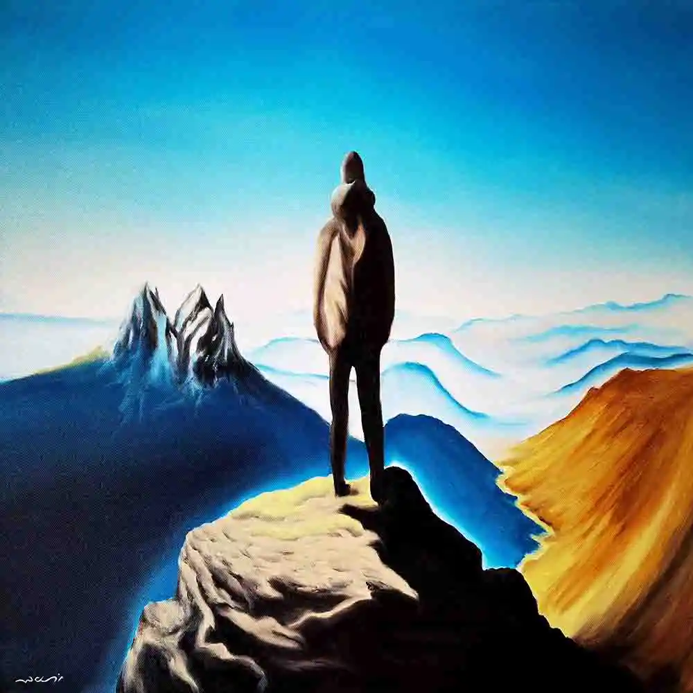 Man Standing on Mountain Peak
