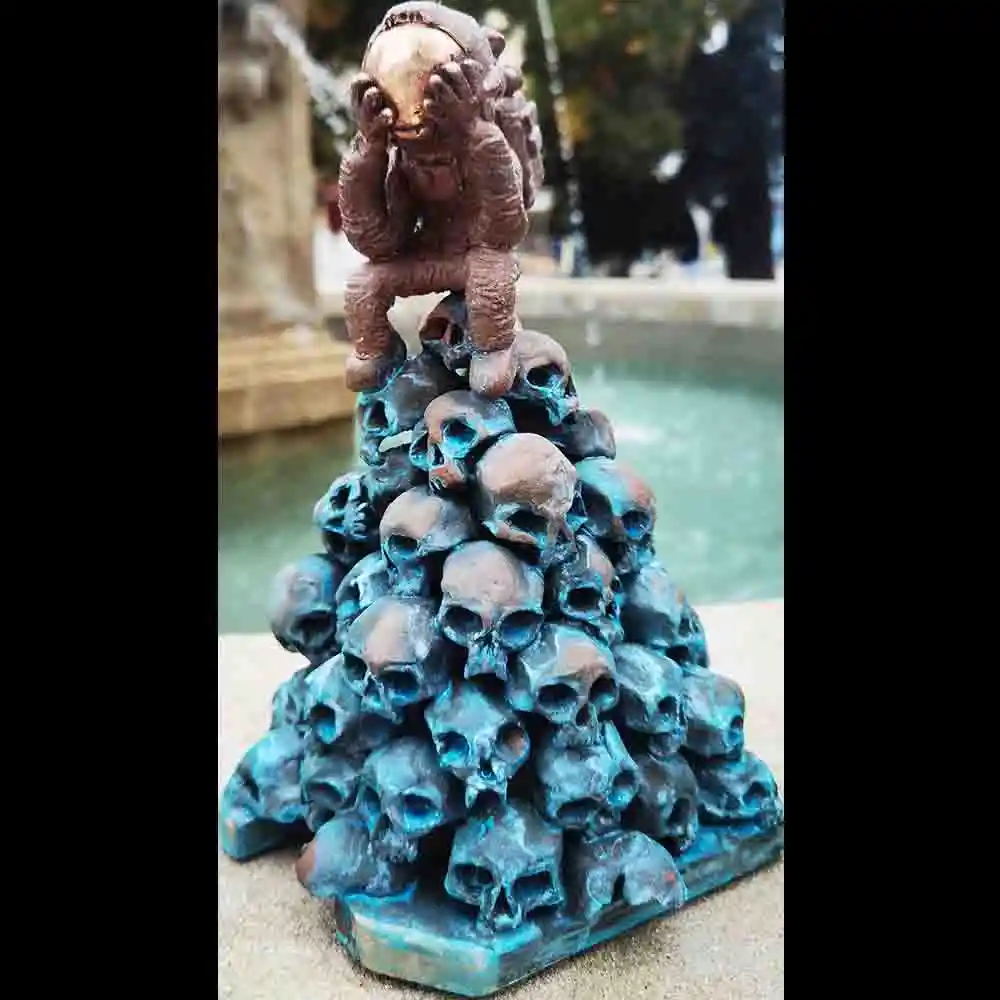 Bronze Thinker Statue on Skulls