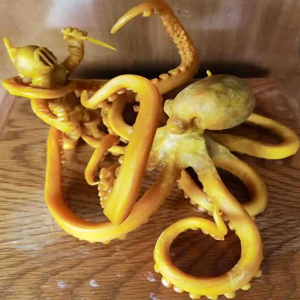 Diver Battles Giant Octopus Sculpture