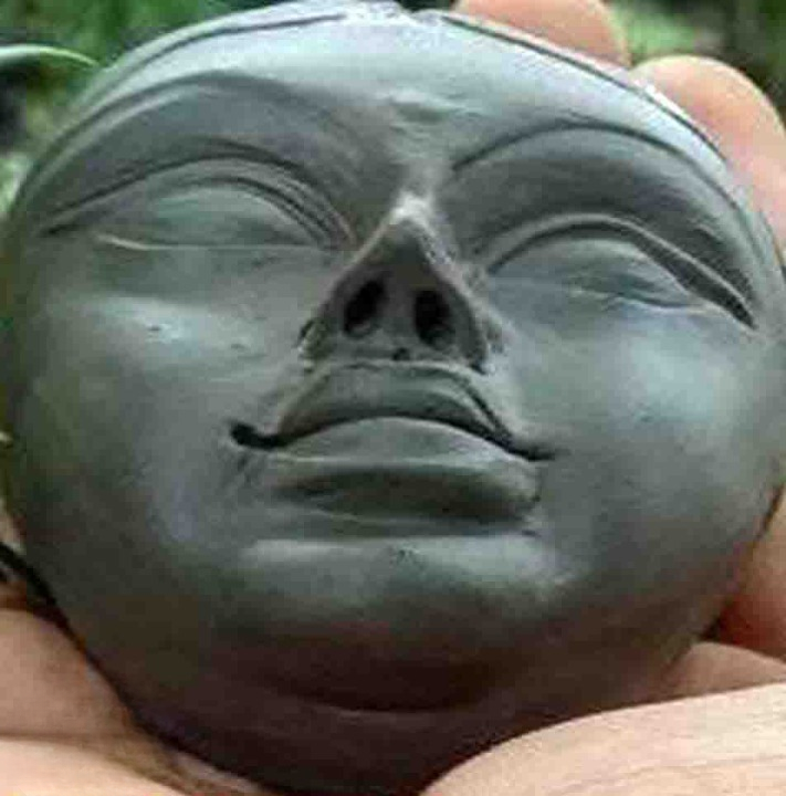 Handmade Clay Sculpture of a Serene Face-1